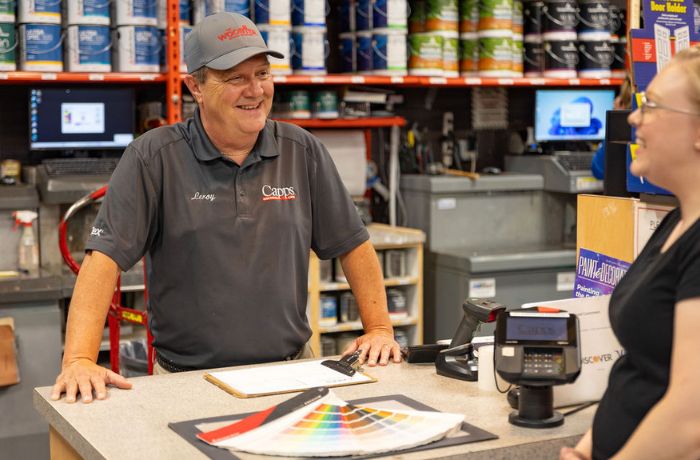 Capps paint department employee helping a customer